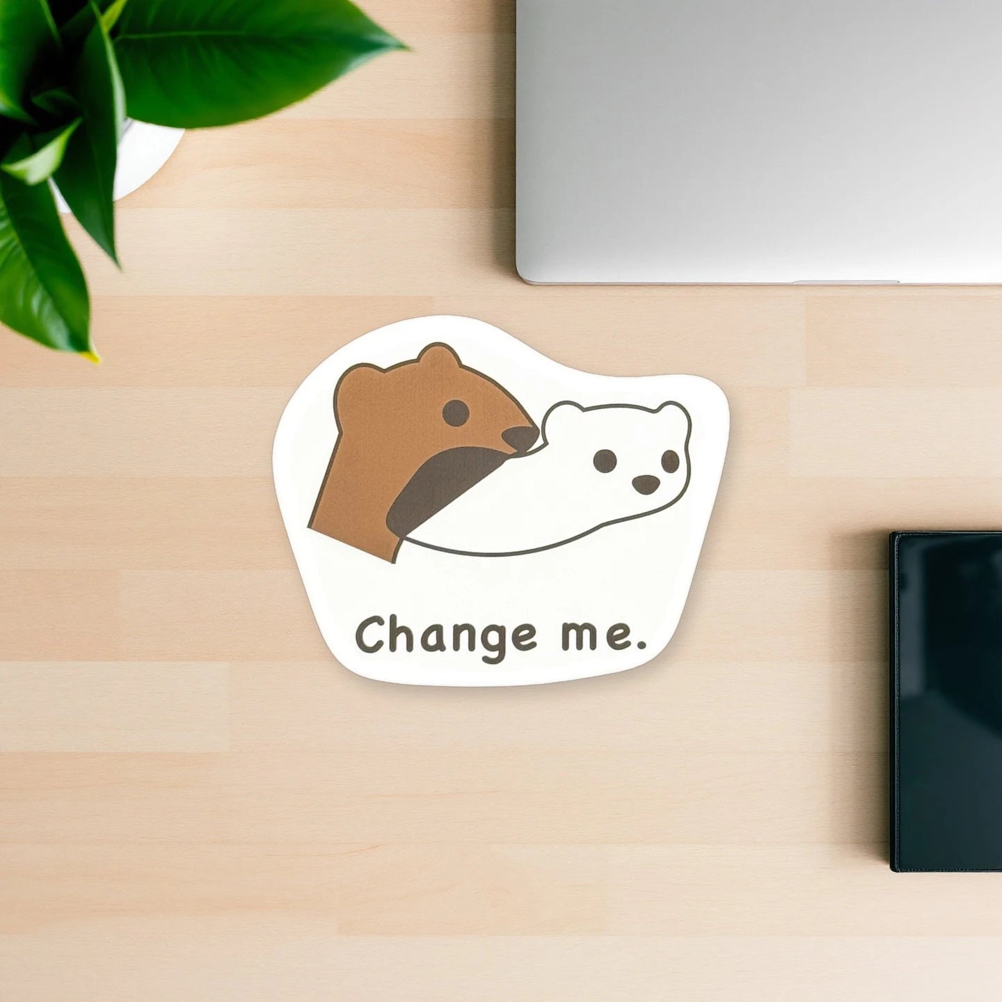 ノートPCのそばに置いたおこじょ（オコジョ）ステッカー「Change me.」の使用イメージ｜おこじょ屋